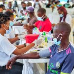 Health check-ups in a community setting.